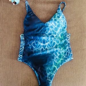 Sexy One Piece with adorable side detailing.